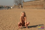 DirtyPublicNudity Naked blonde playing in the sand on a cool day