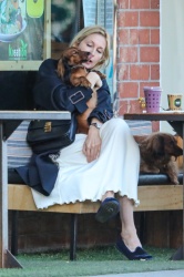 Kelly Rutherford - Loves on her dogs as she enjoys a coffee and smoothie at Kreation Organic Kafe in Beverly Hills, February 18, 2021