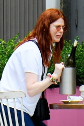 Rose Leslie - Brings her bottle of wine inside as it starts raining on her al fresco dining in New York, June 11, 2021