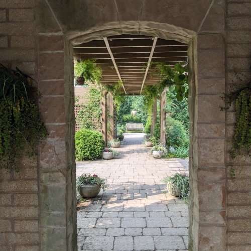 A view through a stone structure in one of the outdoor gardens