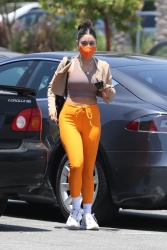 Vanessa Hudgens - turns heads in a bright pair of orange pants as she stops by at a Lowes in Los Angeles, California | 06/01/2021