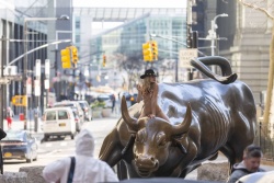 Nude woman charging bull