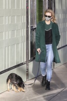 Lili Reinhart - looks stylish in an emerald green coat as she goes for a walk with her dog Milo in Vancouver - December 13, 2020