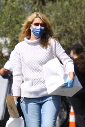 Laura Dern - Keeps her guard up against Covid-19 while picking up food in Brentwood, March 14, 2021