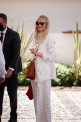 Poppy Delevingne - Spotted in a white pinstriped suit at the Martinez Hotel during the 74th Cannes Film Festival in Cannes, July 14, 2021