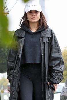 Vanessa Hudgens - wears a massive coat as she braves the rain in Los Angeles, March 13, 2020
