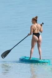 Jennifer Lopez - puts her figure on full display as she goes paddle-boarding on the beach in Turks and Caicos, 01/06/2021