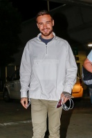 Liam Payne - wears a big smile as he arrives at JFK in New York City surrounded by friendly fans - June 14, 2018