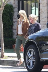 Laura Dern - Points the way while jaywalking as she does some shopping with a friend in Pacific Palisades, May 2, 2021