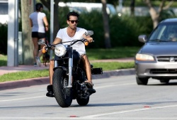 Aaron Diaz - rides his motorcycle through the streets of Miami Beach on June 17, 2013