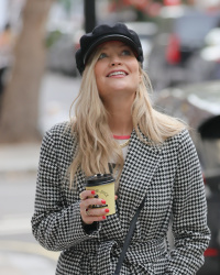 Laura Whitmore - Looked chic in a peak cap and coat as she grabbed a coffee ahead of her BBC radio show in London, November 7, 2021