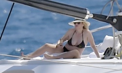 Rebel Wilson - Shows off her recent slimmed-down physique while she's pictured sunbathing on a luxury yacht in Portofino, August 7, 2021