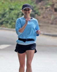 Reese Witherspoon - Out for a solo jog in Brentwood CA 04/23/2024
