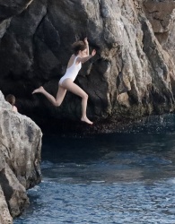 Maya Hawke - Seen jumping into the sea and shows nacked tits in St Bart, December 28, 2022