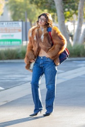 Kylie Jenner - shows off her toned tummy while wearing a fur coat, leaving a meeting - Calabasas CA - February 14, 2024