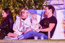 Emma Roberts - Sharing some laughs with a mystery guy at the Coachella festival, Indio CA - April 13, 2024