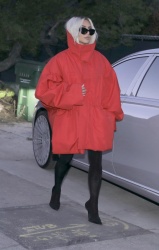 Kim Kardashian - Debuts Chic Blonde Makeover and Oversized Red Coat in Malibu 04/26/2024