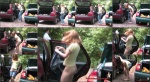 Redhead changing into a skirt in the parking lot