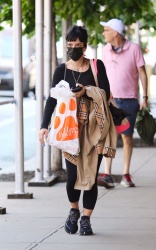 Lily Allen - Has her hands full as she carries her puppy inside her bag while shopping at “Happy Paws” pet supply store in Manhattan, May 21, 2021