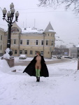Snow falls as the skinny blonde girl flashes her tits