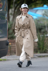 Lily James - Covers up in a trench coat on a stroll in Los Angeles, January 12, 2022