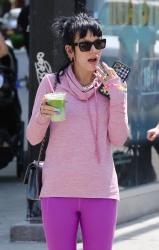 Lily Allen - Looks pretty in a pink sweater and purple leggings while enjoying a green beverage in Manhattan’s Soho area, May 20, 2021