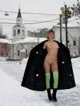 Snow falls as the skinny blonde girl flashes her tits