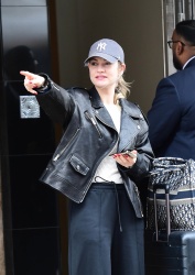 Lily James - Checks out of her hotel in London April 6, 2024