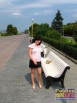 Bald pussy looks inviting on a park bench