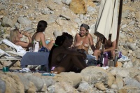 Rita Ora - spotted topless while on the beach with her new boyfriend and friends in Ibiza, Spain | 07/31/2020