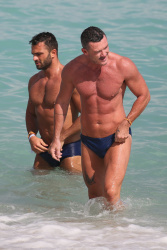 Luke Evans - Shows off his muscles as he hits the beach with model Gustavo Naspolini in Miami, February 23, 2021