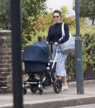 Felicity Jones - Seen for the first time since giving birth as she takes her newborn for a stroll in London, September 14, 2020